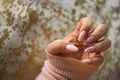 A photo of a woman's hand with beautiful pink gel nails. Royalty Free Stock Photo