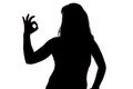 Photo of woman's silhouette showing okey