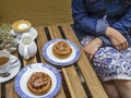 Enjoying Swedish pastry Kanelbulle and coffee