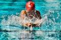 Portrait of Woman Swimming Butterfly Stroke Royalty Free Stock Photo