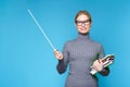 Photo of woman teacher in glasses with pointer and books Royalty Free Stock Photo