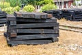 Photo of wooden sleeper, pile up beside railroad