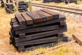 Photo of wooden sleeper, pile up beside railroad