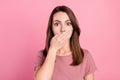 Photo of worried brunette young lady close mouth wear t-shirt isolated on pink color background