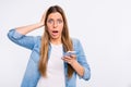 Photo of worried troubled lady holding touching head with hand looking at camera isolated grey background