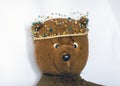 Photo of a 45-year-old bear with a homemade pearl crown on his head,handmade