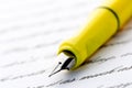 Yellow fountain pen on letter Royalty Free Stock Photo