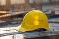 Photo Yellow hard hat safety helmet on construction site, essential gear Royalty Free Stock Photo