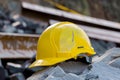 Photo Yellow hard hat safety helmet on construction site, essential gear Royalty Free Stock Photo