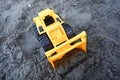 Photo Of A Yellow Toy Bulldozer On The Beach Sand