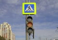 Photo of yellow traffic signal and pedestrian crossing sign. Royalty Free Stock Photo