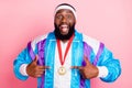 Photo of young african man happy positive smile point fingers golden medal victory sporty isolated over pink color