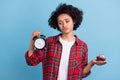 Photo of young afro girl unhappy look clock hold cake dessert sugar diet isolated over blue color background