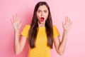 Photo of young amazed girl afraid scared worried nervous panic hands up isolated over pastel color background