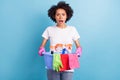 Photo of young amazed wow negative mood afro american woman cleaning service isolated on blue color background Royalty Free Stock Photo