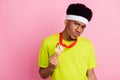 Photo of young arrogant afro guy sportsman show gold medal victory isolated over pink color background