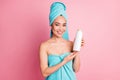 Photo of young asian woman happy smile hold bottle shampoo conditioner enjoy hair care  over pastel color Royalty Free Stock Photo