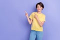 Photo of young attractive adorable pretty girl wear yellow t-shirt cute smile fingers pointing empty space Royalty Free Stock Photo