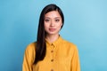 Photo of young attractive asian business woman happy positive smile confident isolated over blue color background Royalty Free Stock Photo
