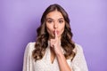 Photo of young attractive charming pretty positive hold finger on lips silence quiet on purple color background