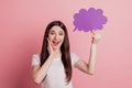 Photo of young attractive girl amazed surrpised news happy positive smile hold paper cloud isolated over pink color