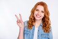 Photo of young attractive girl happy positive smile show peace cool v-sign isolated over grey color background Royalty Free Stock Photo
