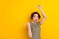 Photo of young attractive lady directing fingers empty space amazed crazy shopping deal isolated on bright yellow color