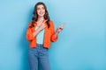 Photo of young attractive positive promoter woman wear orange shirt direct fingers look empty space new shop isolated on