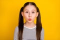 Photo of young attractive school girl pouted lips send air kiss over yellow color background