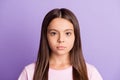 Photo of young attractive schoolgirl concentrated serious confident isolated over violet color background