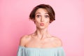 Photo of young attractive woman amazed shocked surprised pouted lips isolated over pastel color background Royalty Free Stock Photo