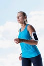 Portrait of young attractive woman running in park Royalty Free Stock Photo