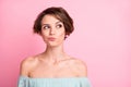 Photo of young attractive woman unhappy upset uncertain hesitate doubt look empty space isolated over pink color Royalty Free Stock Photo