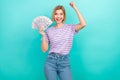 Photo of young awesome winner woman triumphant raised fist up hooray hold much money huge investment isolated on Royalty Free Stock Photo