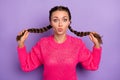 Photo of young beautiful attractive pretty lovely sweet girl pull braids pout lips isolated on purple color background