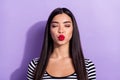 Photo of young beautiful charming dreamy asian woman pout lips kiss with closed eyes  on purple color background Royalty Free Stock Photo