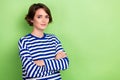 Photo of young beautiful lady arms crossed professional hr recruiter manager wear blue striped shirt isolated green