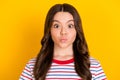 Photo of young beautiful pretty lovely smiling girl pout lips wear striped t-shirt  on yellow color background Royalty Free Stock Photo