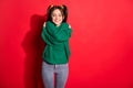 Photo of young beautiful smiling cheerful positive female hug embrace herself isolated on red color background Royalty Free Stock Photo