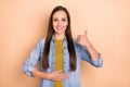 Photo of young beautiful woman touch stomach show thumb up good health isolated on beige color background