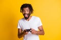 Photo of young black guy hold controller finger joystick open mouth wear white t-shirt isolated yellow color background