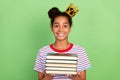 Photo of young black school girl happy positive smile book learn study royalty isolated over green color background