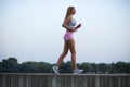 Young fitness girl brisk walking Royalty Free Stock Photo