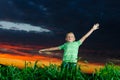 Photo of young boy raising hands