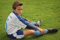 Photo of young boy who is concentrate before his soccer match