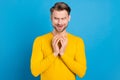 Photo of young brown hair man tricky cunning have idea look empty space isolated over blue color background