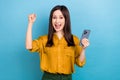 Photo of young ceo manager lady wear formal yellow shirt fist up celebrate her first ecommerce order hooray yelling Royalty Free Stock Photo