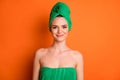 Photo of young charming lady after shower look camera wear green towel turban isolated orange color background Royalty Free Stock Photo