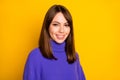 Photo of young charming pretty happy smiling positive lovely girl in purple sweater isolated on yellow color background