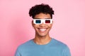 Photo of young cheerful african man happy positive smile wear 3d glasses watch movie isolated over pastel color Royalty Free Stock Photo